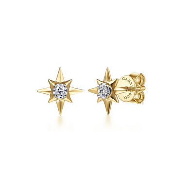 Gold starburst stud earrings with center diamonds on white background