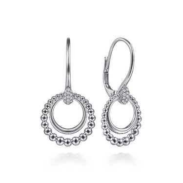 Sterling silver dangle earrings with beaded double circle and small pavé accent, on white background.