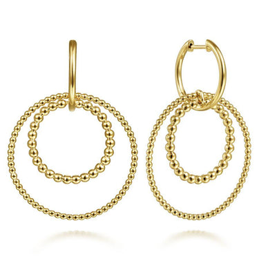 Yellow gold dangle earrings with double beaded open circle design on white background
