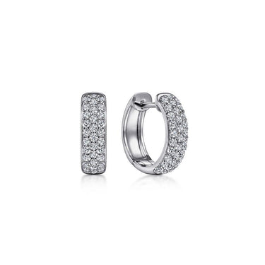 White gold diamond huggie hoop earrings with pavé setting on white background