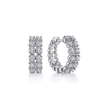 White gold hoop earrings with double rows of round brilliant diamonds on white background
