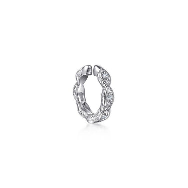 White gold diamond huggie hoop earring with leaf motif on white background