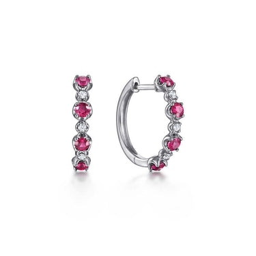 White gold hoop earrings with alternating round rubies and diamonds on white background