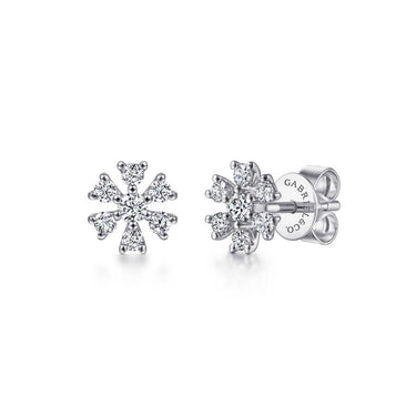 White gold diamond cluster stud earrings in a floral snowflake design on white background