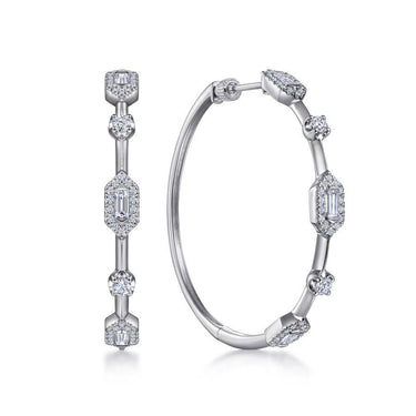 White gold hoop earrings with round and baguette diamonds, geometric design, on white background