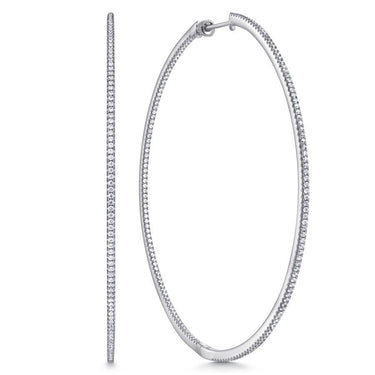 White gold large diamond hoop earrings with pavé setting on white background