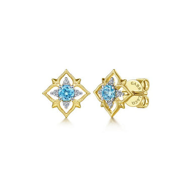 Yellow gold stud earrings with blue gemstone center and diamond accents in floral design