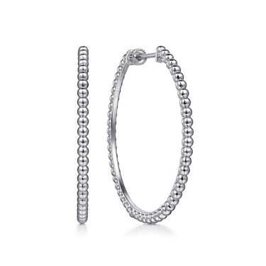 Sterling silver beaded hoop earrings with polished finish on white background