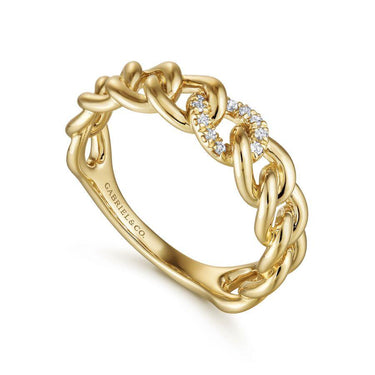 Yellow gold chain link ring with pavé diamonds on a white background