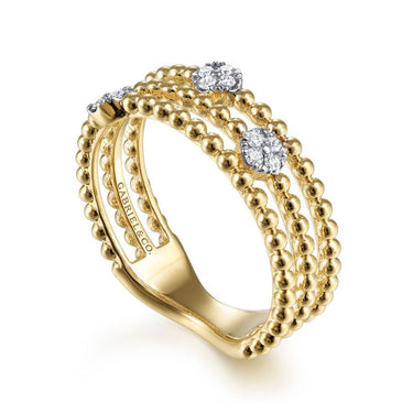 Gold beaded band ring with round diamond accents and intricate detailing