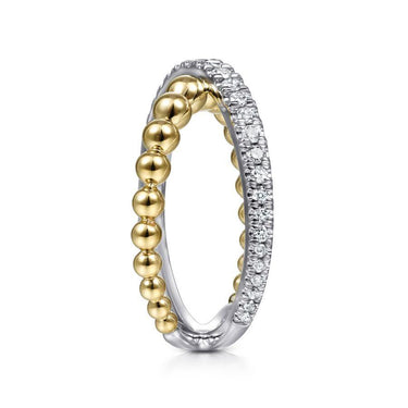 Two-tone gold and diamond band with round bead accents and pavé set diamonds