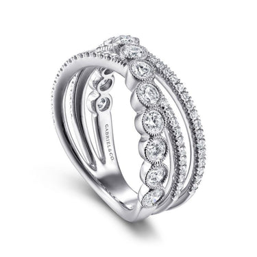 White gold diamond bridal ring with oval and round pavé stones, elegant milgrain detailing