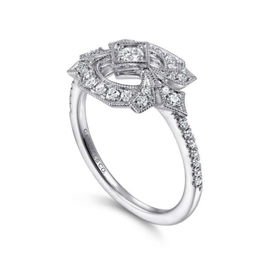 Intricate white gold diamond engagement ring with vintage-inspired halo setting