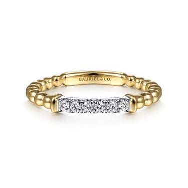 Yellow gold beaded band ring with row of round white diamonds on top