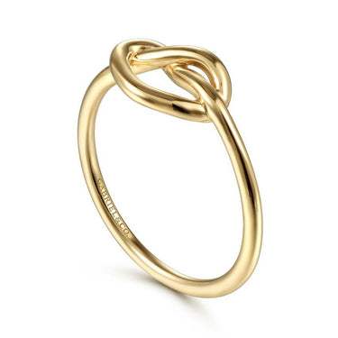 Yellow gold knot ring with polished finish, minimalist fine jewelry on white background