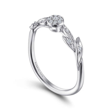 White gold diamond floral engagement ring with leaf detailing and round cluster setting