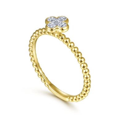Yellow gold beaded ring with diamond clover flower design on top, elegant jewelry
