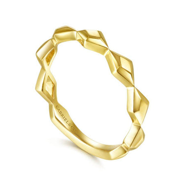 Geometric yellow gold band ring with faceted design on white background