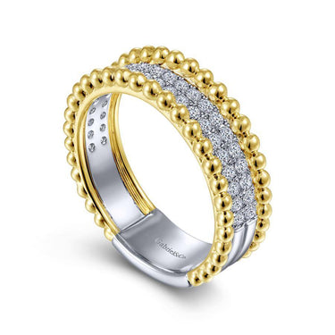 Gold and diamond wedding band with beaded edges and pavé-set diamonds on a white background