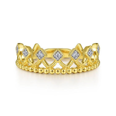 Gold crown-shaped ring with diamond accents on white background