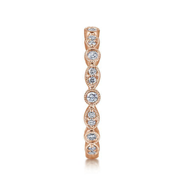 Rose gold diamond stackable band with alternating round and marquise shapes on white background.