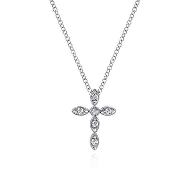 Diamond cross pendant necklace on silver chain with marquise and round stones, white background
