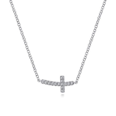 Diamond sideways cross pendant necklace on a silver chain, fine jewelry close-up