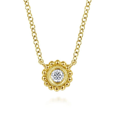 Gold necklace with round diamond pendant and intricate beaded border design
