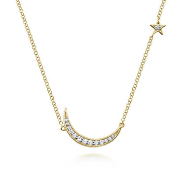 Gold necklace with diamond crescent moon and star pendant on a delicate chain