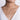 Woman wearing a delicate white gold round diamond pendant necklace