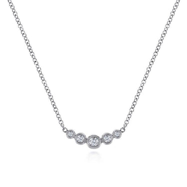 White gold necklace with five round bezel-set diamonds on a delicate chain