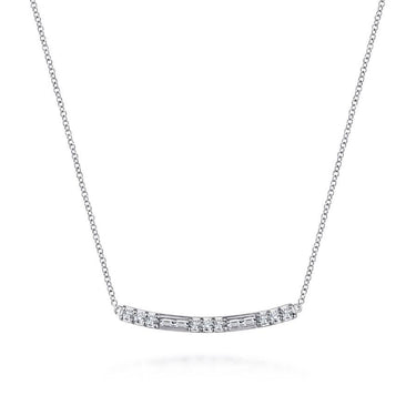 White gold bar necklace with round and baguette diamonds on a delicate chain