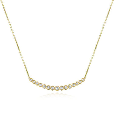 Gold necklace with round bezel-set diamonds in a curved bar design on white background