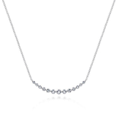 White gold necklace with round diamonds on a delicate chain, minimalist jewelry