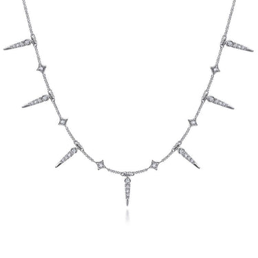 White gold diamond station necklace with alternating spike and diamond-shaped pendants
