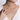 Woman wearing a delicate diamond pendant necklace on a silver chain