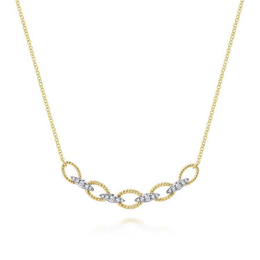 Yellow gold necklace with twisted links and diamond-accented marquise shapes.