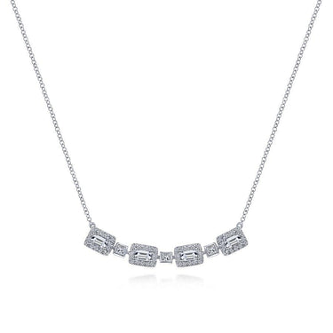 White gold necklace with geometric diamond accents on a delicate chain against a white background