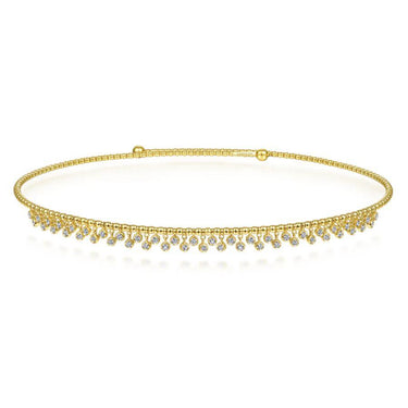 Gold diamond tennis necklace with beaded detail and dangling round gemstones, on white background