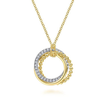 Gold necklace with interlocking diamond and beaded circle pendants on white background