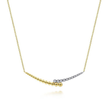 Yellow gold necklace with graduated gold beads and round white gemstone accents on chain