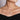 Woman wearing gold necklace with round diamond pendant