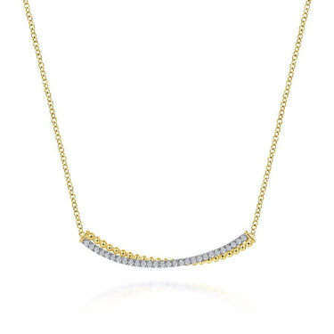 Yellow gold necklace with a curved diamond bar pendant on a white background