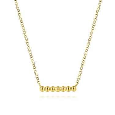Minimalist yellow gold beaded bar necklace on delicate chain, fashion jewelry