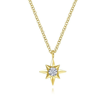 Gold starburst pendant necklace with central round diamond on gold chain, fine jewelry