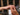 Woman placing diamond engagement ring on finger, elegant bridal jewelry moment